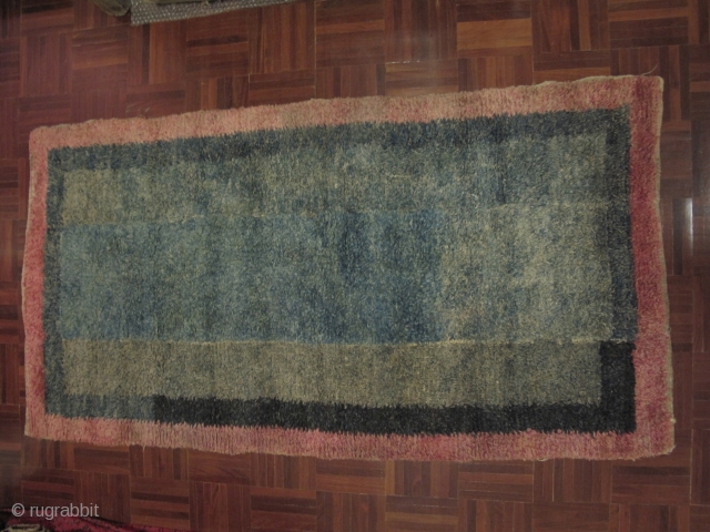 Tibetan Tsukdruk, looped pile rug - a primitive form of ancient nomadic tibetan carpet weaving. 3 long strips sewn together vertically. Very nice hue of green in the centerfield, Excellent condition, Approx  ...