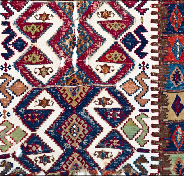 Early East Anatolian kelim one-piece weaving with white cotton ground and great colour.  Though battered,  the piece is virtually its original size and format: parts of both the original ends  ...