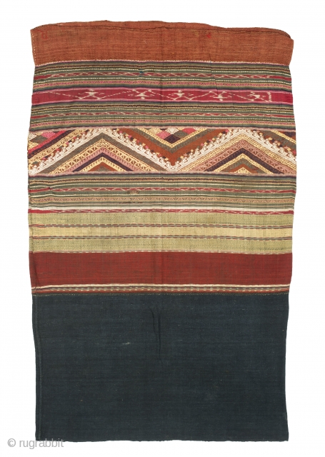 Name: Woman’s skirt/Ceremonial textile
Local Name: Sin mii kan
Ethnic Group: Tai Lue
Origin: Northwest Laos
Materials: Cotton, silk, natural and synthetic dyes
Techniques: Discontinuous supplementary weft, weft ikat
Age: Early 20th century
Size: 100 x 60 cm

Tubular skirts  ...