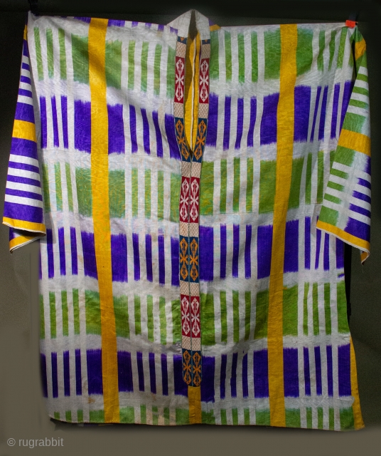   Large ikat Kuylak with embroidery down the front , bold geometric graphics in good wearable condition.  Uzbekistan mid century , collected in the field over 50 years ago. info@singkiang.com 
