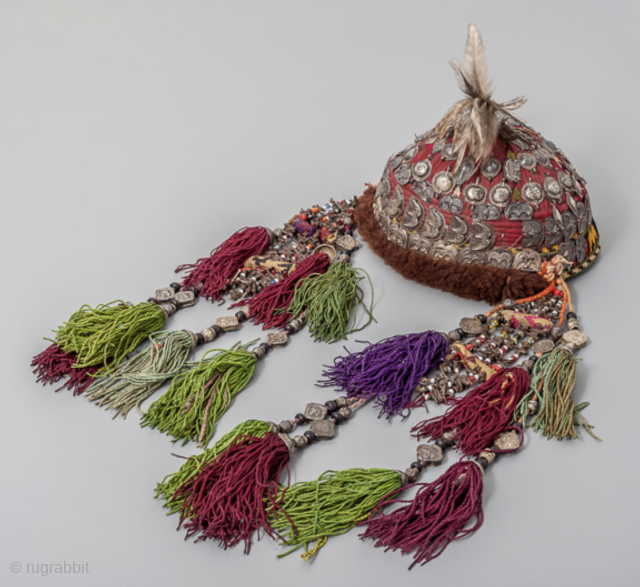 A real not put together antique headdress with silver, cloves, feathers, glass and silk and cotton tassels. Turkoman late 19th, early 20th c info@singkiang.com for more info and price    