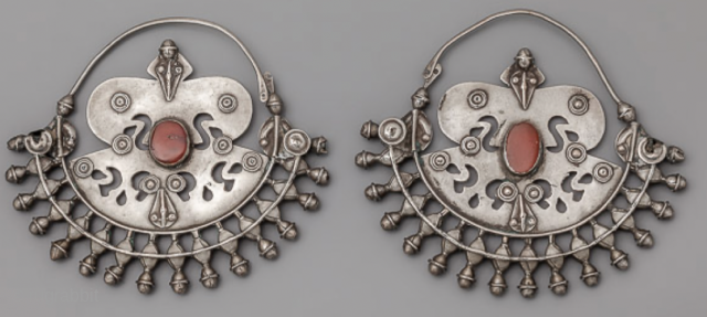  An early pair of silver Turkoman earrings with carnelian                       
