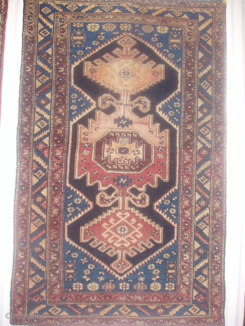 A semi-antique Zanjan rug. Measuring 2.11m x 1.32m.                         