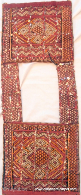 MOROCCAN BERBER MIDDLE ATLAS SADDLE BAG which is of exceptional fineness and was probably woven as a dowry piece. It has a plain, fine kilim background upon which design has been embroidered  ...