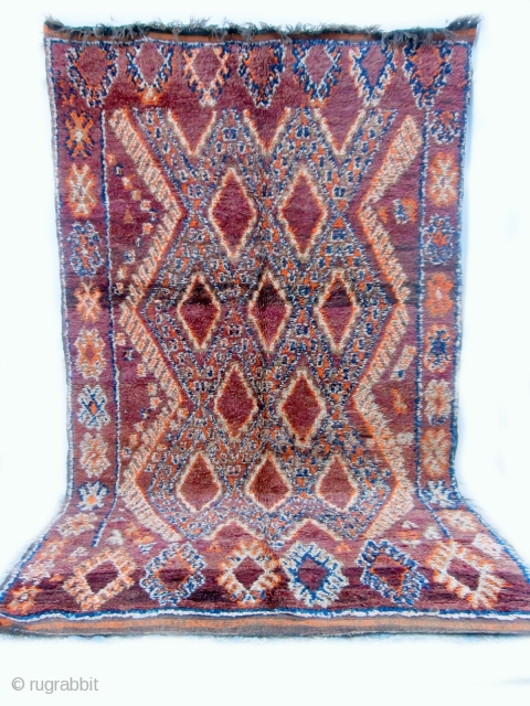 MOROCCAN BERBER MIDDLE ATLAS CARPET although the diamond lattice design is often used in rugs from the Beni Mguild Berbers in the southern Middle Atlas mountains, it is unusual to find the  ...