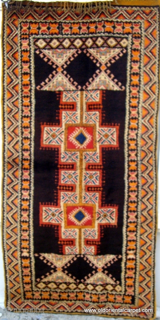 MOROCCAN HIGH ATLAS BERBER RUG which has beautiful soft lustrous wools including a mixture of undyed brown and black in the centre field. It is from the region of Tazenacht, south of  ...