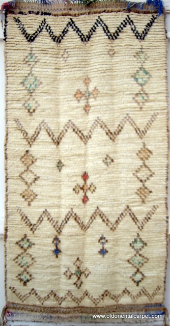 MOROCCAN HIGH ATLAS BERBER RUG. The long, piled, silky field includes several designs with attractive pastel colours. It is from the region of Azilal and is in excellent condition complete with original  ...