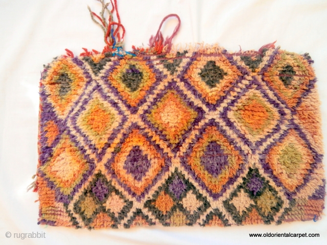 MOROCCAN HIGH ATLAS BERBER BAG / CUSHION This piled bag is from the Ait Bou Ichaouen small tribe in the extreme east of the High Atlas mountains. This area is so isolated  ...