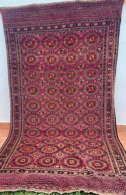 ANTIQUE SALOR TURKOMAN CARPET which dates from the second half of the 19th century. The typical repeated gul throughout the centre panel is that used by Salor weavers. The pile is low  ...