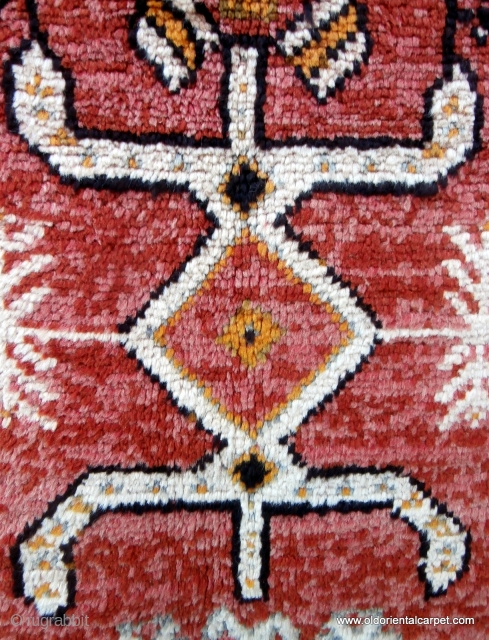 MOROCCAN BERBER RUG originating from the High Atlas mountains and the Ait Ouaouzguite Berbers. This region lies south of Marrakesh. At each end of the field there is a design which translates  ...
