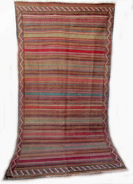 KURDISH KILIM FROM THE REGION OF QUCHAN which lies between the city of Meshed and extends north to the Persian border with Turkmenistan. It is a fine old piece with dozens of  ...