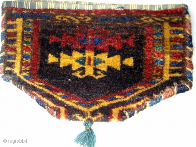 www.oldorientalcarpet.com TURKOMAN TRIBAL BAG This was probably used as a purse and is composed of two Yamut camel knee decorations which have been joined together with overcasting of the same colour as  ...