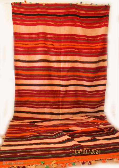 MOROCCAN ARAB KILIM. A huge piece which would have been used as a communal blanket for sleeping at night and probably a curtain dividing the tent or dwelling during the day. It  ...