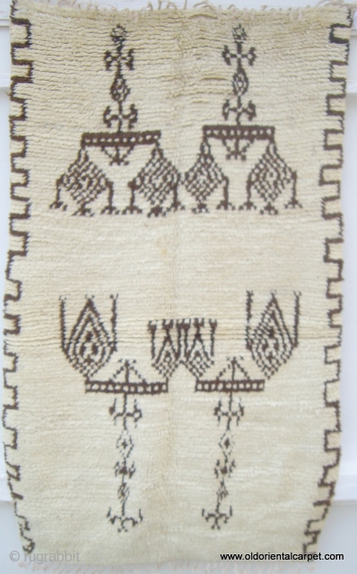 MOROCCAN MIDDLE ATLAS BERBER RUG. A rare and fascinating rug from the Berbers of Beni Ourain in the Middle Atlas mountains. It is soft and supple with lustrous wools with undyed brown  ...