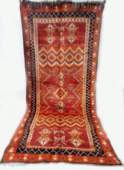 MOROCCAN BERBER HIGH ATLAS CARPET. The high knot density and lustrous shades of the many colors used makes this old example special. Many Ait Tamassine Berber pieces have this overall effect of  ...