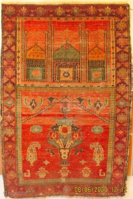 ANTIQUE PRAYER RUG FROM XINJIANG, the north west annexed province of China and home to the Uighur Moslem people.   The piece probably dates from the 3rd quarter, 19th c.   ...