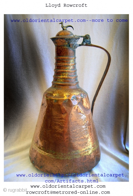 ANTIQUE PERSIAN WATER CONTAINER. An unusual example of a hand beaten copper and brass water vessel from Persia dating from the 19th century. The metals ensured that water was stored in cool  ...