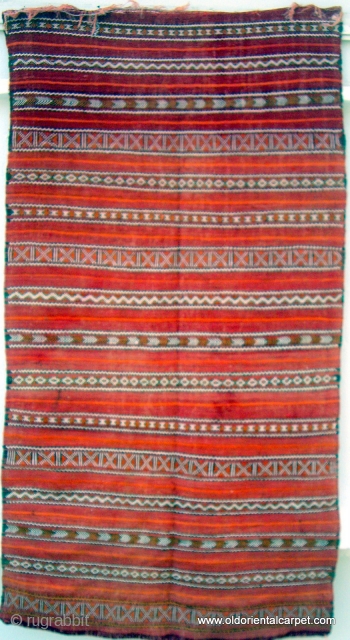 MOROCCAN BERBER MIDDLE ATLAS FLAT WEAVE / KILIM. The shape and fineness of weave and embroidery indicate that this would have been used as a cape for a Berber woman, probably for  ...