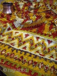 MOROCCAN HIGH ATLAS BERBER CARPET. This old carpet is from the region of Ait Ouaouzguite in the High Atlas mountains south of Marrakech. The dyes include colours taken from henna, saffron and  ...