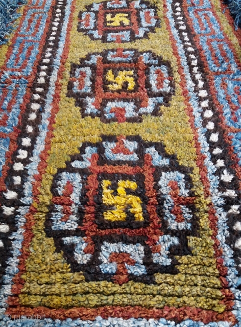 Old Tibetan Wangden rug, khaden size (circa 175 by 90 cm, fringes included), powerful three medaillon with bright yellow swastikas design, unusual brillant colors with rare green field, good age, genuine and  ...