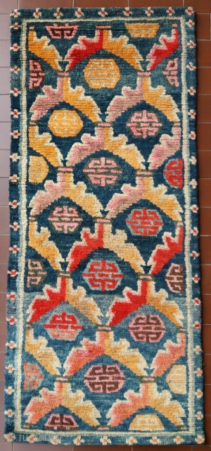 Very nice old Tibetan rug, very early 1900, very pleasant colors, very nice and soft wool, very unusual small size (circa 113 by 49 cm), very good condition (no repairs, full pile),  ...