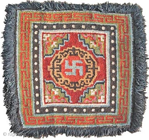 SRW15
Sitting Rug, Tibet, Late 19th-Early 20th
78x82cm excluding fringe
Wool warp and weft.
Natural dyes.

This rug would have been used on the seat of an important monk or Lama, such that the hairy fringe would  ...