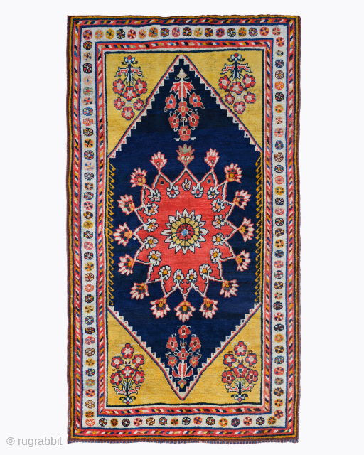 Period: Late 19th Century
Origin: Iran
Dimensions: 120 x 230 cm

This late 19th century Gabbeh, woven by the nomadic Qashqai tribes of Southwest Persia, is a vibrant and highly expressive example of tribal folk  ...