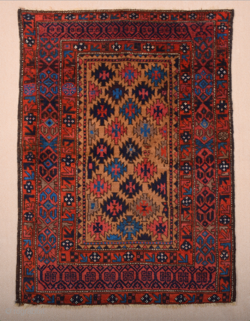 Late 19th Century North East Persian Belüch Rug. This small Baluch woven in the symmetrical knot is from the Qainat region and maybe a weaving of the Bahluli tribe. The camel field  ...