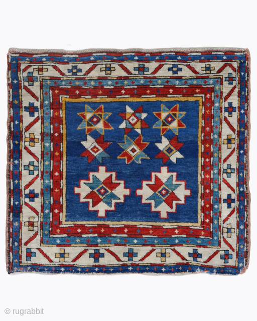 Period: Late 19th Century
Origin: Caucasus
Dimensions: 70 x 75 cm
This rare late 19th century Caucasian Kazak rug highlights a powerful and rhythmic geometric composition featuring a vertical arrangement of eight pointed “Lesghi” stars ...
