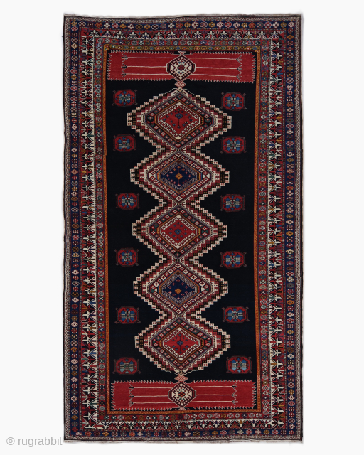 Period: Late 19th Century
Origin: Shirvan, Caucasus
Dimensions: 198 x 358 cm

This rare late 19th century Caucasian Shirvan rug highlights a powerful and rhythmic geometric composition featuring a vertical sequence of five monumental, nested  ...