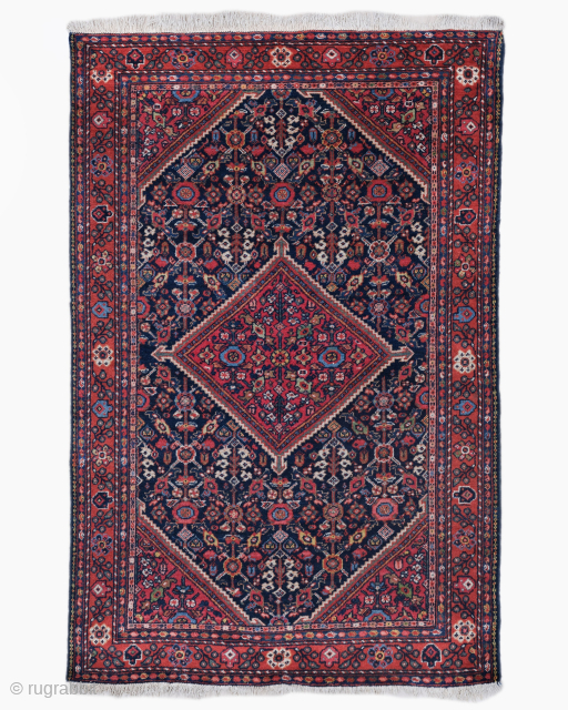 Period: Late 19th Century
Origin: Mahal, Iran
Dimensions: 135 x 206 cm
This rare late 19th century Persian Mahal rug highlights a powerful and rhythmic floral composition featuring a monumental, diamond shaped central medallion in ...