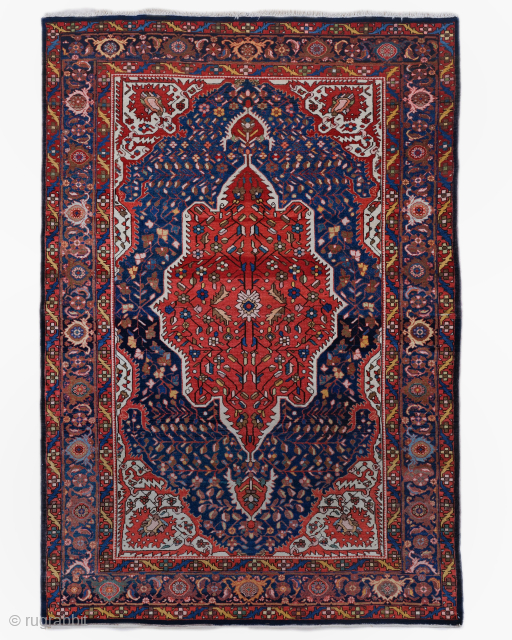 Period: Early 20th Century
Origin: Sarouk, Iran
Dimensions: 145 x 212 cm

This rare early 20th century Persian Sarouk rug highlights a powerful and rhythmic floral composition featuring a monumental, multi lobed hexagonal medallion in  ...