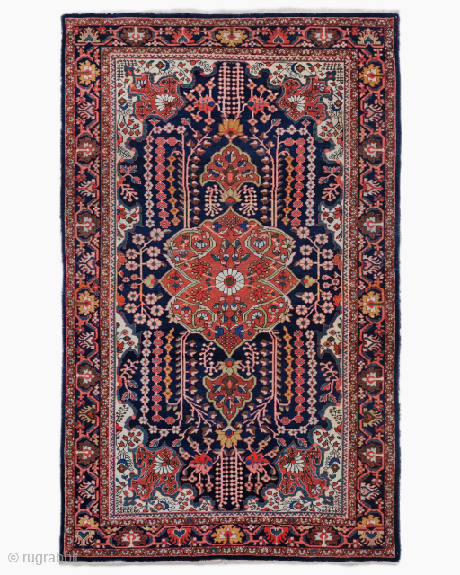 Period: Early 20th Century
Origin: Sarouk, Iran
Dimensions: 130 x 210 cm

This rare early 20th century Persian Sarouk rug highlights a powerful and rhythmic floral composition featuring a centralized scalloped medallion anchored within a  ...