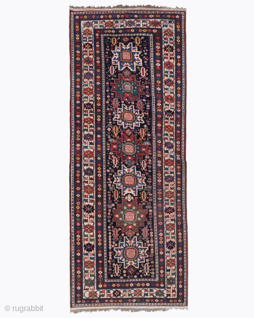 Period: Late 19th Century
Origin: Caucasus
Dimensions: 117 x 300 cm

This rare late 19th century Caucasian Shirvan Lezgi runner highlights a powerful and rhythmic geometric composition featuring a vertical arrangement of five iconic “Lesghi  ...