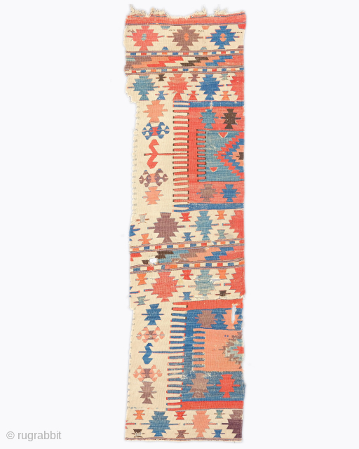 Period: 18th Century
Origin: Konya, Turkey
Dimensions: 56 x 202 cm

This rare 18th century Konya kilim fragment highlights a powerful and rhythmic geometric composition featuring a segmented field anchored within a luminous ivory ground.  ...
