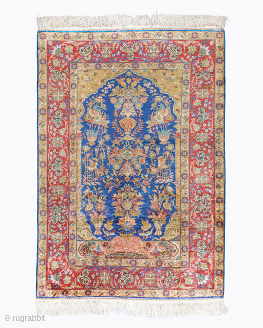 Period: Mid 20th Century
Origin: Kayseri, Turkey
Dimensions: 137 x 200 cm

This rare mid 20th century Turkish Kayseri silk prayer rug highlights a powerful and rhythmic botanical composition featuring a classic Tree of Life  ...