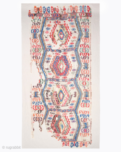 Period: Late 18th Century
Origin: Central Anatolia
Dimensions: 150 x 354 cm

This rare late 18th century Central Anatolian kilim highlights a powerful and rhythmic geometric composition featuring a vertical sequence of four large hexagonal  ...