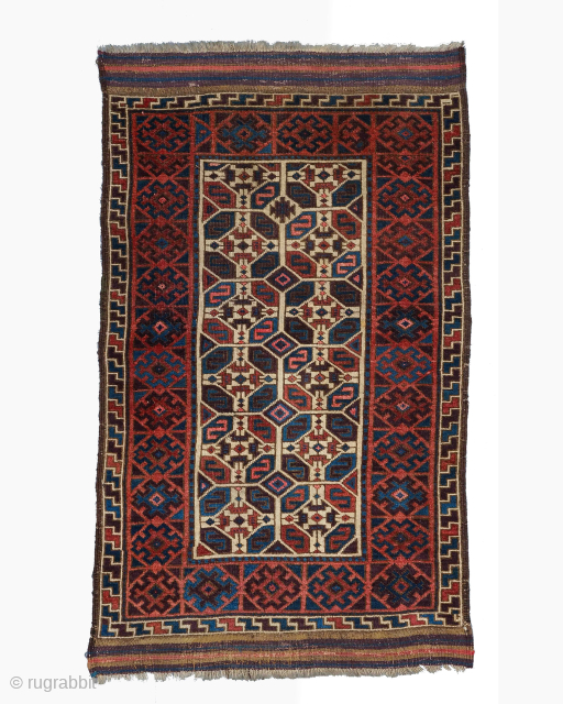 Middle of 19th Century North East Persia, Baluch Rug

In this Baluch rug of the head and shoulders type, the border is recessed at right angles in the upper section of the field,  ...