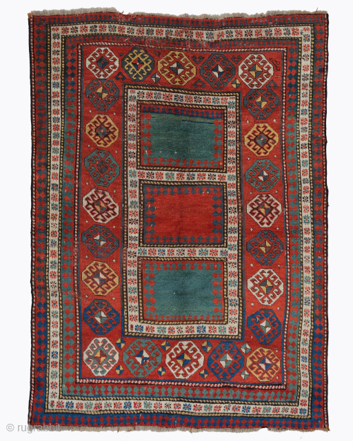 Period: Mid 19th Century
Origin: Caucasus
Dimensions: 140 x 205 cm
This rare mid 19th century Caucasian Kazak rug highlights a powerful and rhythmic geometric composition featuring a vertical sequence of three primary rectangular medallions ...