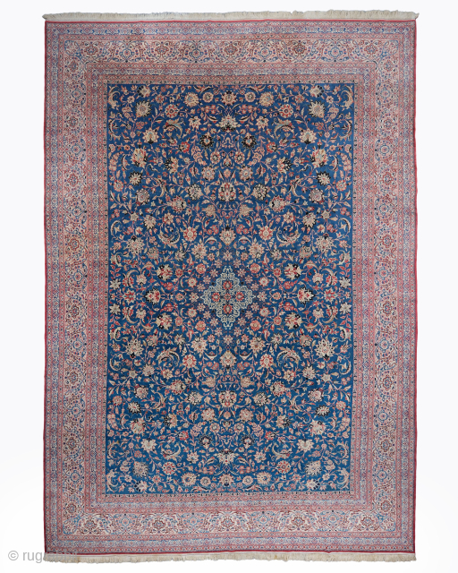 Period: Early 20th Century
Origin: Iran
Dimensions: 320 x 475 cm

This rare early 20th century Persian Nain Tudesk carpet highlights a powerful and rhythmic floral composition featuring a centralized diamond medallion anchored within a  ...