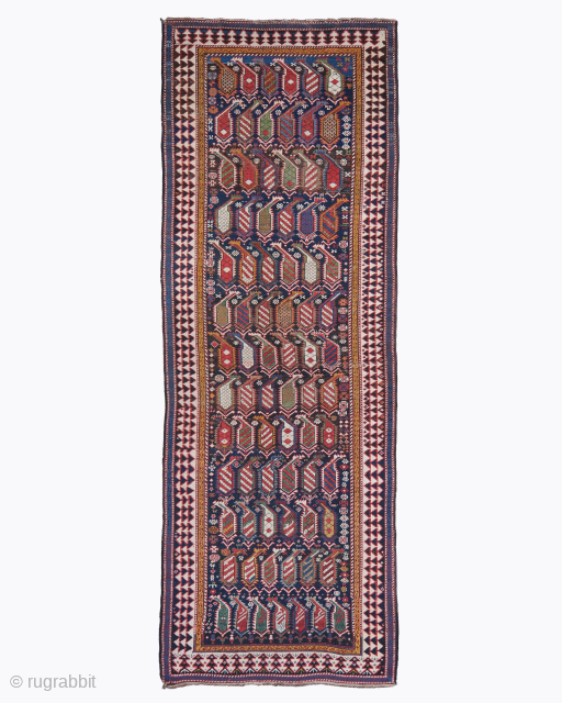 Period: Mid 19th Century
Origin: Marasali, Shirvan
Dimensions: 116 x 325 cm

This rare mid 19th century Caucasian Shirvan Marashali rug highlights a powerful and rhythmic geometric composition featuring a vertical sequence of “boteh” motifs  ...