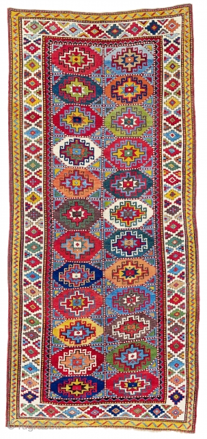 Mİddle of 19th Century South East Caucasian Moghan Rug.The striking, hooked stepped polygon filling each of the 24 compartments in the two-row composition of this Moghan is known as a Memling gül.  ...