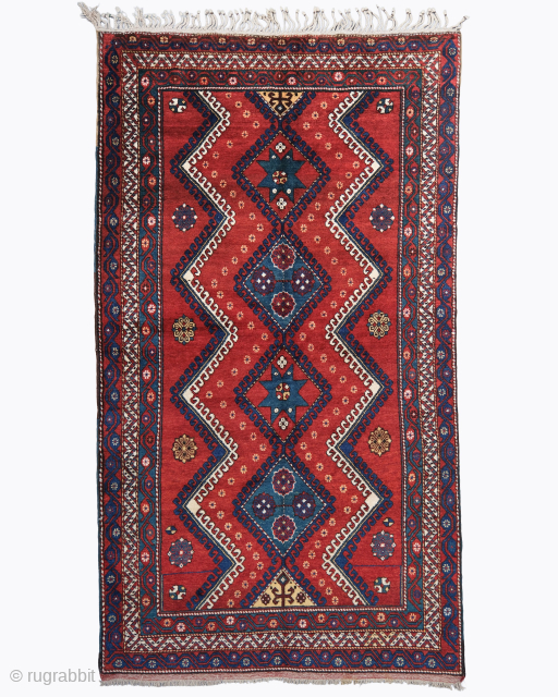 Period: Late 19th Century
Origin: Caucasus
Dimensions: 170 x 300 cm

This rare late 19th century Caucasian Kazak rug highlights a powerful and rhythmic geometric composition featuring a vertical sequence of three large scale nested  ...