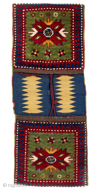 Late 19th Century Southwest Caucasian Complete double bags from the Kazak region are rarely seen in the market. In this example, the two faces show a large star on a green ground,  ...