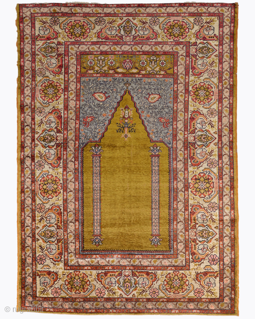 Period: Mid 20th Century
Origin: Sivas
Dimensions: 120 x 168 cm

This rare mid 20th century Sivas silk rug highlights a powerful and rhythmic floral composition featuring a radiant golden-ochre mihrab anchored within a luminous  ...