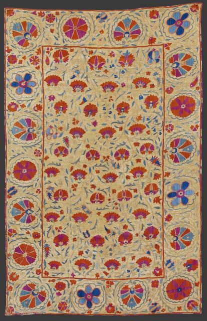 Mid 19th century Central Asia, South West Uzbekistan Bokhara Suzani.A Bokhara suzani in the nim format. The field displays a repeat of delicate golden stems bearing red side-view flowers, slender green leaves  ...