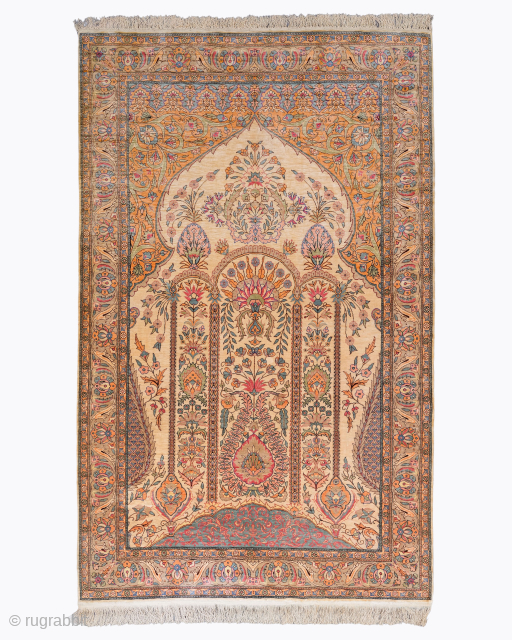Period: Mid 20th Century
Origin: Kayseri
Dimensions: 126 x 206 cm

This rare mid 20th century Kayseri silk rug highlights a powerful and rhythmic composition featuring a sophisticated triple-arched mihrab structure anchored within a luminous  ...