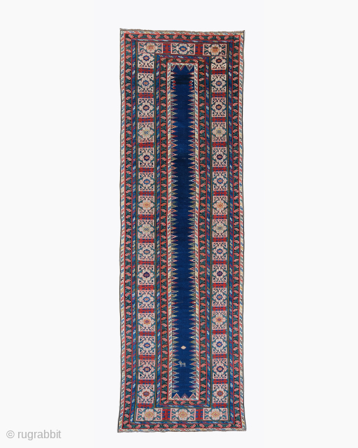 Period: Mid 19th Century
Origin: Kuba, Caucasian
Dimensions: 110 x 360 cm
This rare mid 19th century Caucasian Kuba Shirvan runner highlights a powerful and rhythmic geometric composition featuring an elongated midnight indigo field framed ...