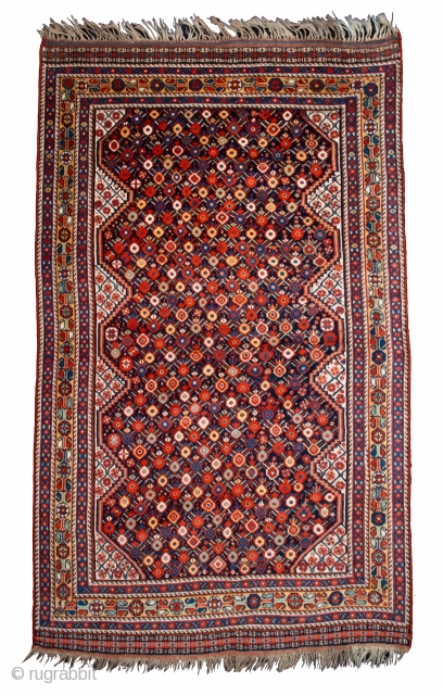 Second half 19th century South West Persian,Khamseh Rug
This very beautiful Khamseh woven by a Baharlu/Ainalu tribal group features a dense repeat of pomegranates in brilliant and diverse colours against a midnight blue  ...