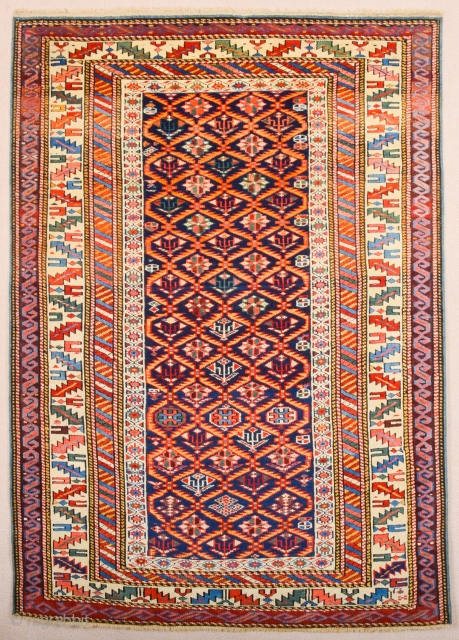 A blue-ground Kuba displaying a lattice design of yellow serrated leaves enclosing flowering shrubs. Mid 19th Century Shirvan Kuba Rug It has a nice pile on it. Lovely colors Size 110 x  ...